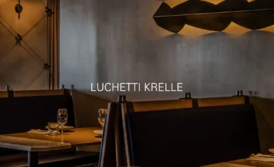 Luchetti Krelle elegant restaurant booth seating with warm mood lighting and sophisticated hospitality interiors