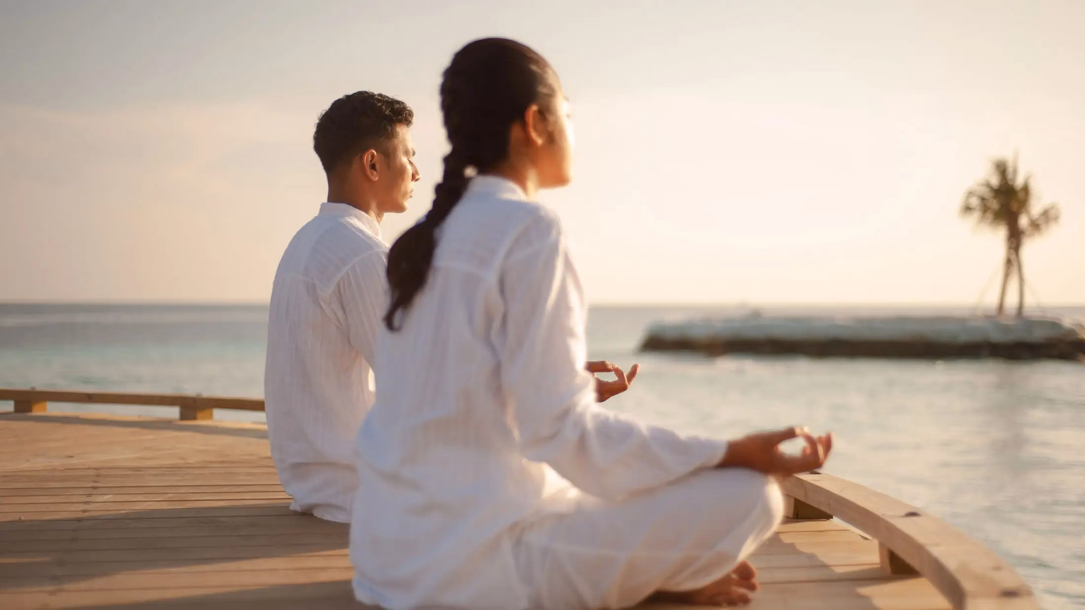 Website for Judy Chapman Spa Consultant. Two people doing yoga by the ocean. Design and art direction by the Ludbrook Agency