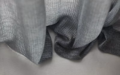 Svenska KJ textured sheer fabric curtains with soft gray tones and elegant contemporary material detailing