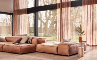 Svenska KJ airy living space with sheer blush curtains and soft modular seating in warm natural daylight